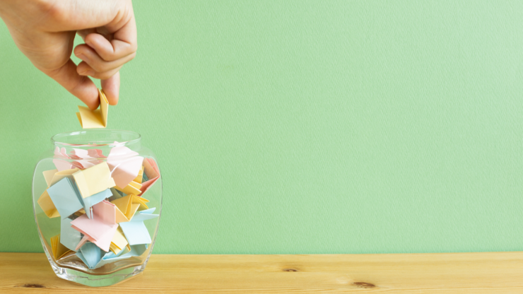 Draw lots. Folded colorful papers in bowl