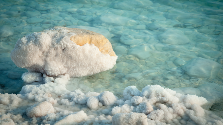 Salt crystals on the stones in water