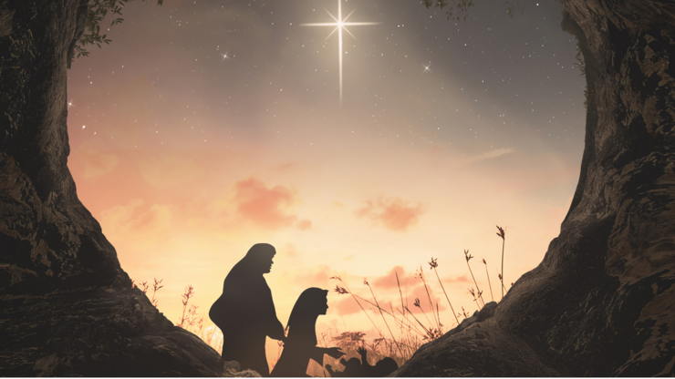 Christmas religious nativity story concept: Silhouette mother Mary and father Joseph looking Jesus born in birth manger with heart shape of tomb stone on night