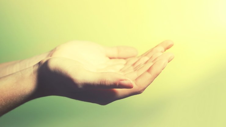 Female hand on colorful background